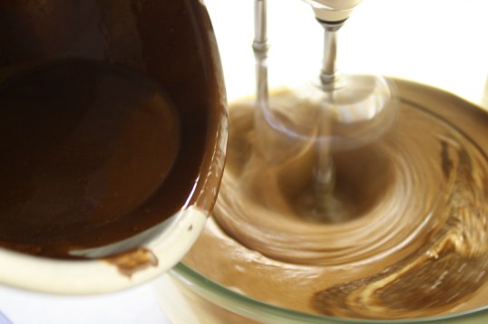 Add melted chocolate mixture to egg/sugar mixture