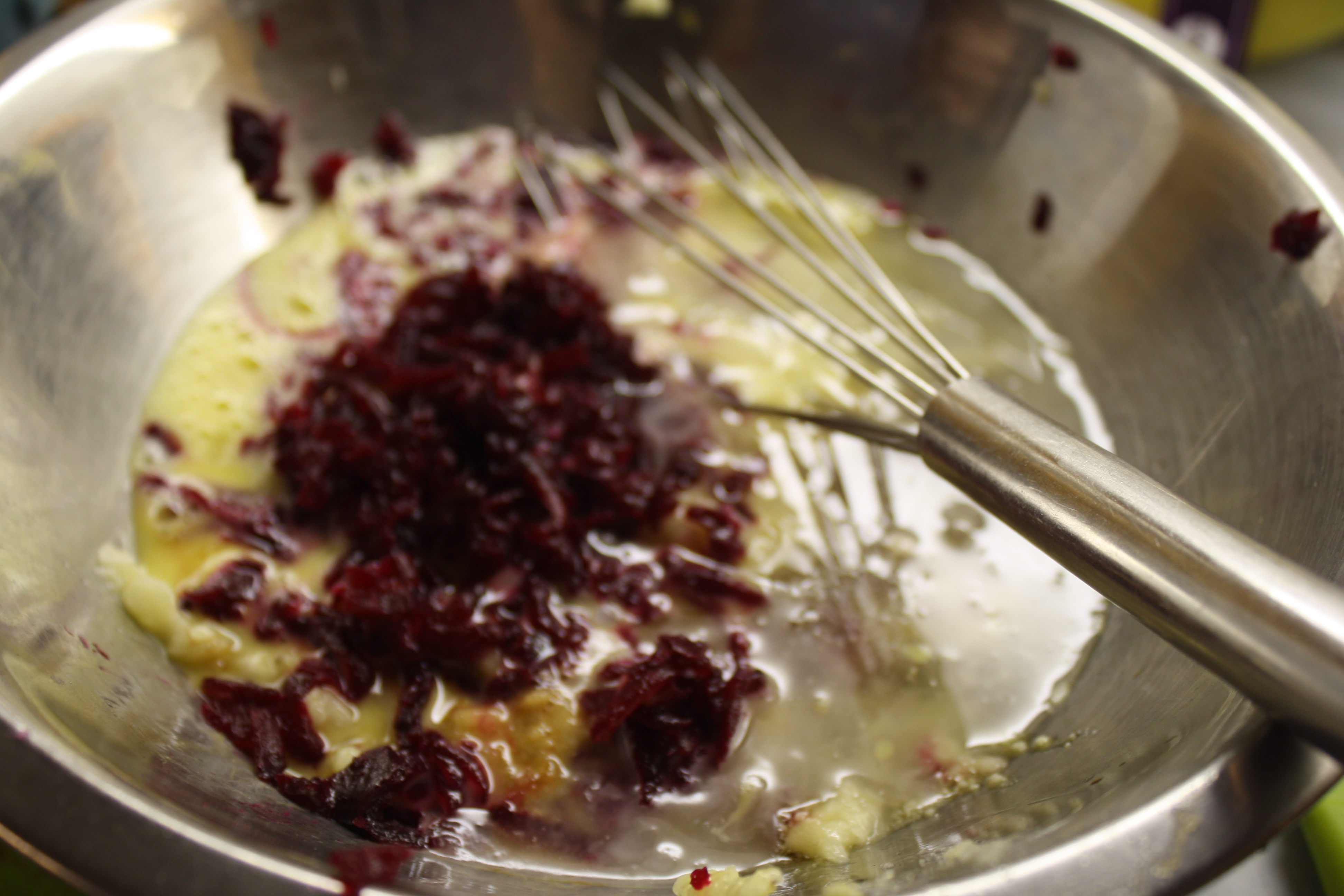 mix together grated beet, banana, egg, oil, vanilla and syrup