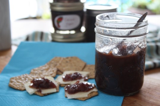 onion jam on a cracker with old cheddar